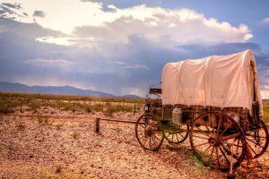 Antique Covered wagon in storm